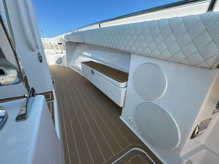  Yacht Photos Pics Luxury interior of 2022 HCB Lujo boat with cushioned seating and speakers.