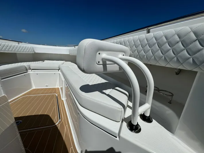  Yacht Photos Pics Luxurious 2022 HCB Lujo boat interior with white quilted seating and sleek design.