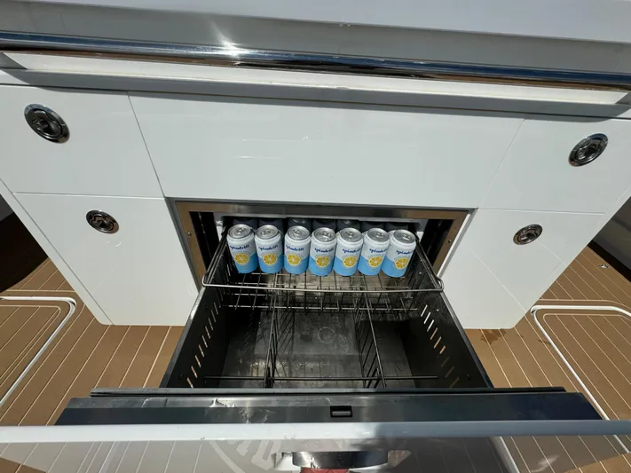  Yacht Photos Pics Open drawer on HCB Lujo 2022 yacht with canned drinks inside.