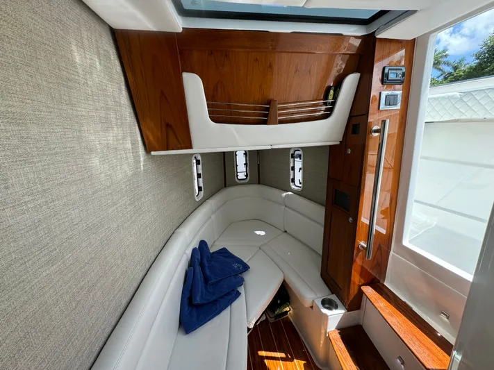  Yacht Photos Pics Luxurious 2022 HCB Lujo boat interior with elegant wood and leather seating.