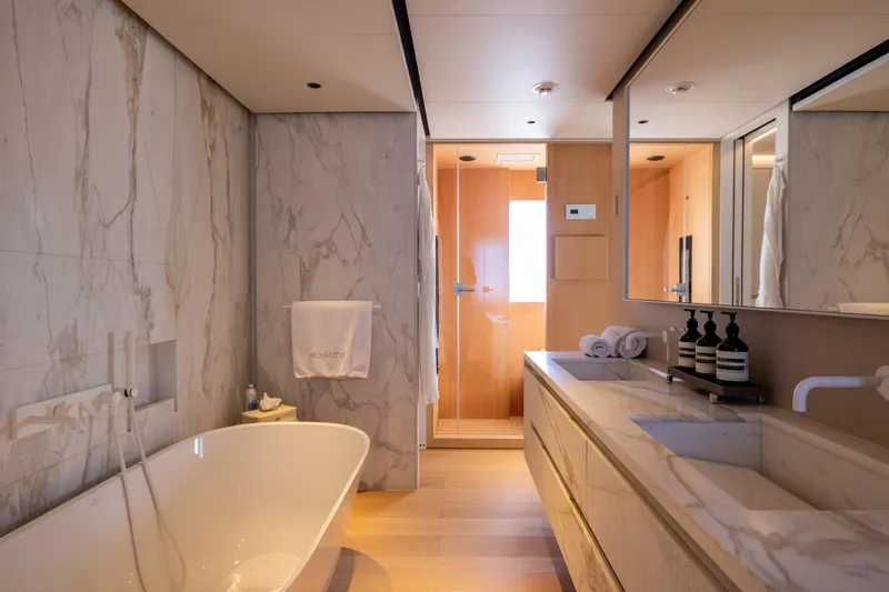 Stellamar Yacht Photos Pics Luxurious bathroom in 2023 Cantiere Delle Marche RJ 115 yacht with marble finishes.
