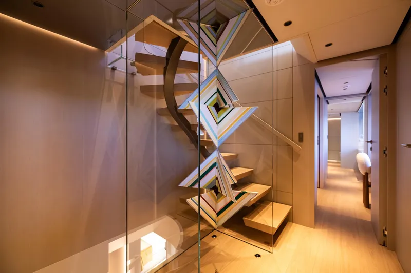 Stellamar Yacht Photos Pics Modern interior of 2023 Cantiere Delle Marche RJ 115 yacht with stylish staircase design.