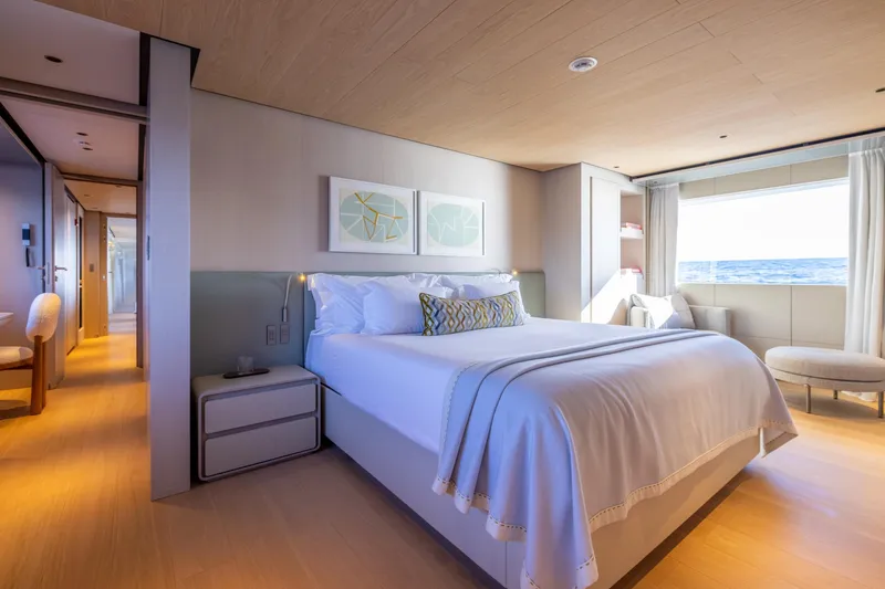 Stellamar Yacht Photos Pics Luxurious bedroom interior of 2023 Cantiere Delle Marche RJ 115 yacht with ocean view.