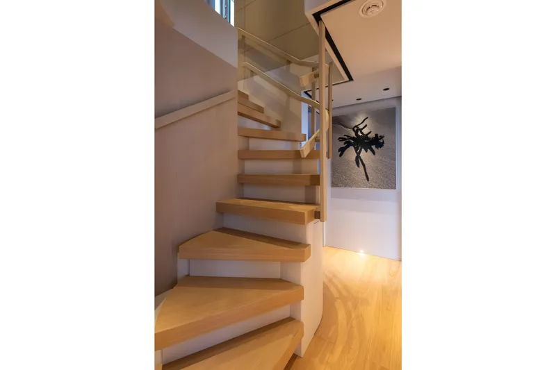Stellamar Yacht Photos Pics Modern wooden staircase on Cantiere Delle Marche RJ 115 yacht, 2023 model.