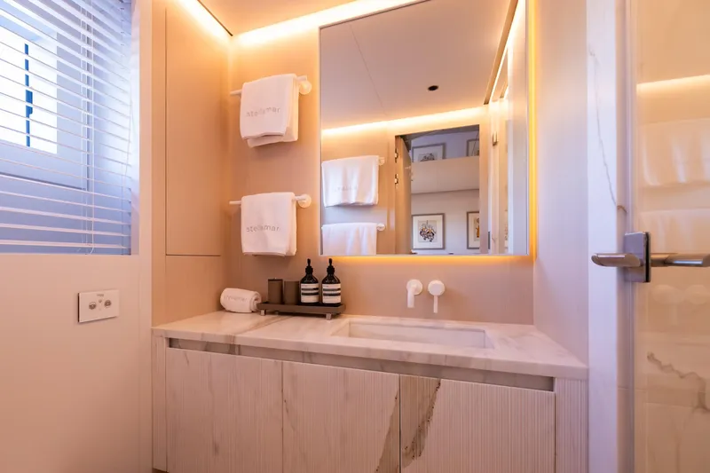 Stellamar Yacht Photos Pics Luxurious bathroom in 2023 Cantiere Delle Marche RJ 115 yacht, featuring elegant lighting and modern fixtures.