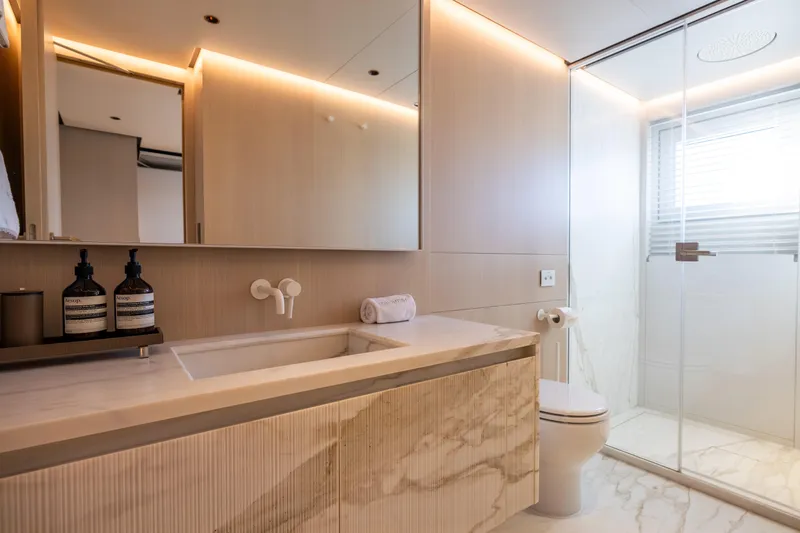 Stellamar Yacht Photos Pics Luxurious bathroom in 2023 Cantiere Delle Marche RJ 115 yacht, featuring modern design and marble finishes.