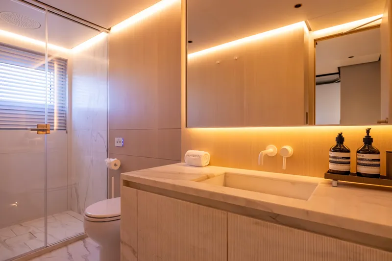 Stellamar Yacht Photos Pics Luxurious bathroom on 2023 Cantiere Delle Marche RJ 115 yacht, featuring modern fixtures and ambient lighting.