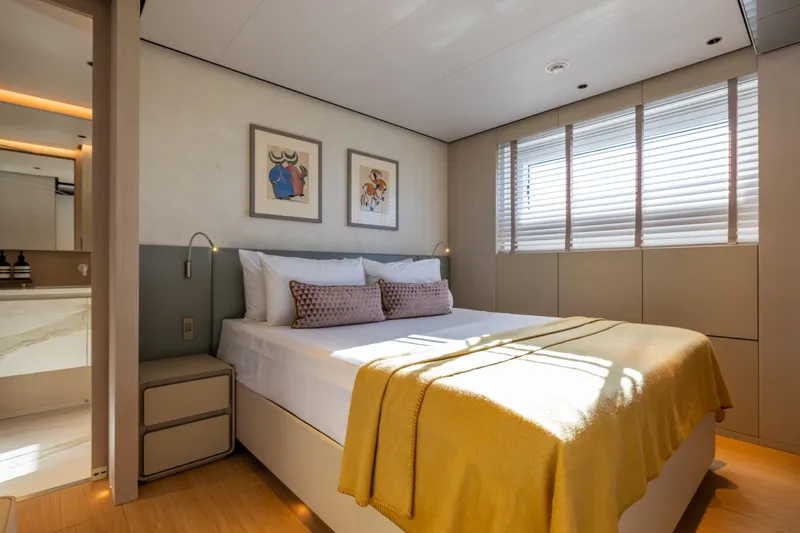 Stellamar Yacht Photos Pics Luxurious bedroom interior on 2023 Cantiere Delle Marche RJ 115 yacht, featuring modern decor and natural light.
