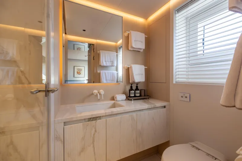Stellamar Yacht Photos Pics Luxurious bathroom in 2023 Cantiere Delle Marche RJ 115 yacht, featuring elegant design and modern amenities.