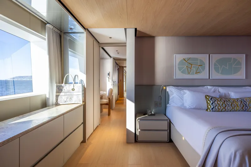 Stellamar Yacht Photos Pics Luxurious interior of 2023 Cantiere Delle Marche RJ 115 yacht, featuring elegant bedroom and ocean view.