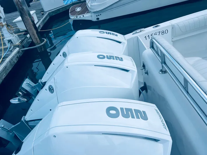 Donnalee2 Yacht Photos Pics 2004 Fountain 38 LX boat with triple outboard engines docked.