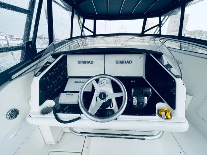 Donnalee2 Yacht Photos Pics 2004 Fountain 38 LX boat cockpit with Simrad navigation system.