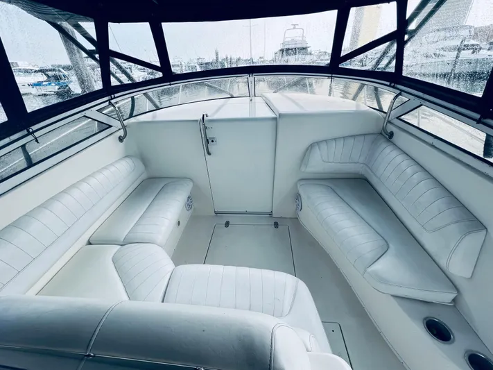 Donnalee2 Yacht Photos Pics 2004 Fountain 38 LX boat interior with white leather seating.