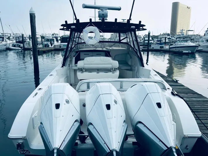 Donnalee2 Yacht Photos Pics 2004 Fountain 38 LX boat with triple outboard engines docked at marina.