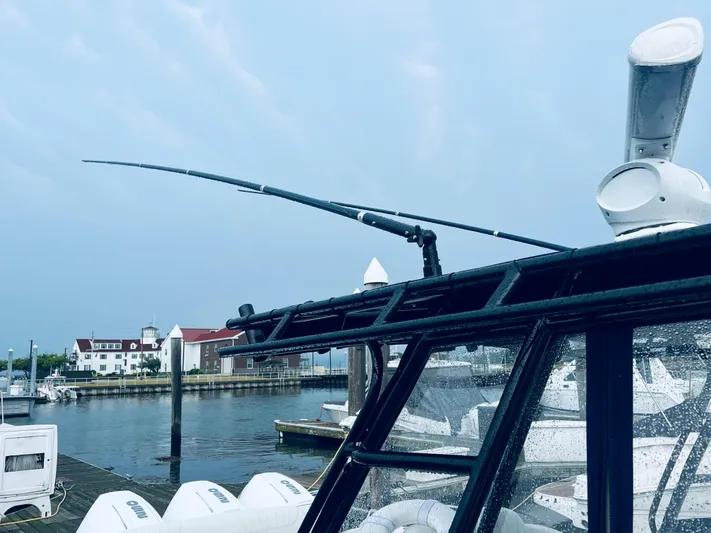 Donnalee2 Yacht Photos Pics 2004 Fountain 38 LX boat docked at a marina with a scenic waterfront view.