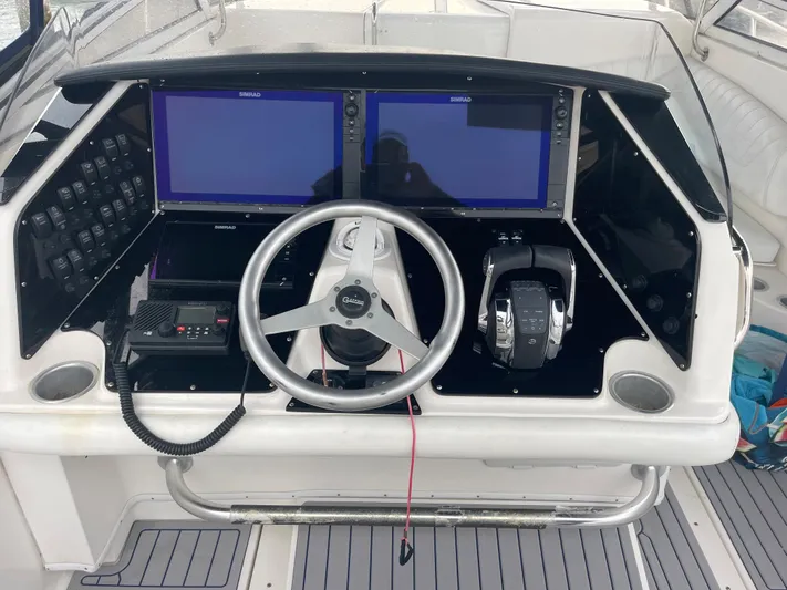 Donnalee2 Yacht Photos Pics 2004 Fountain 38 LX boat dashboard with dual screens and steering wheel.