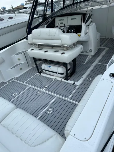 Donnalee2 Yacht Photos Pics 2004 Fountain 38 LX boat interior with white seating and gray flooring.