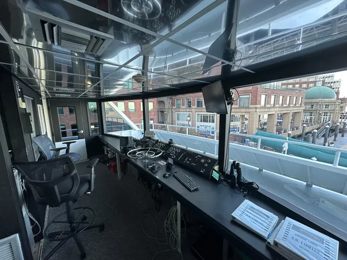 Sir Winston Yacht Photos Pics Interior of a 2007 custom passenger vessel's control room with navigation equipment.