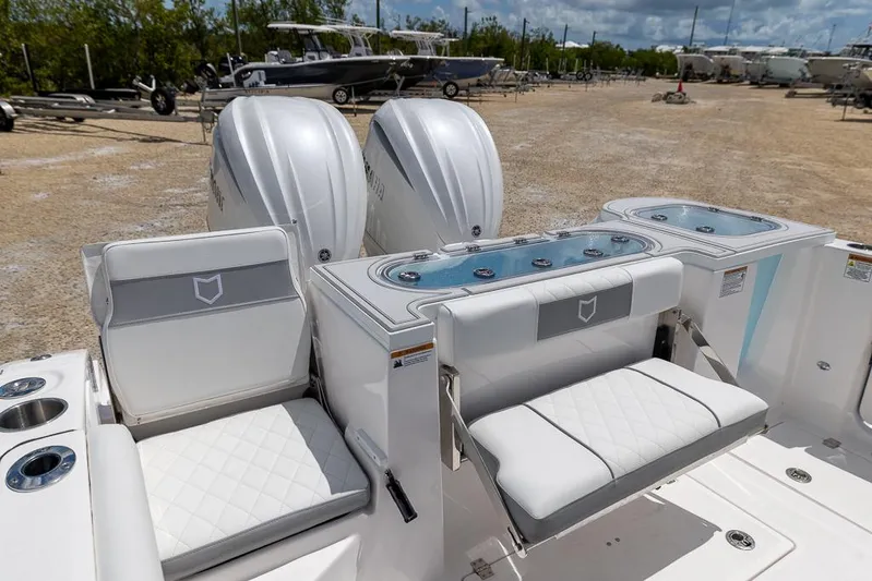  Yacht Photos Pics 2026 Sea Fox 288 Commander boat interior with dual engines and cushioned seating.