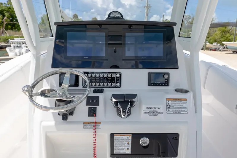  Yacht Photos Pics 2026 Sea Fox 288 Commander helm with dual screens and modern controls.