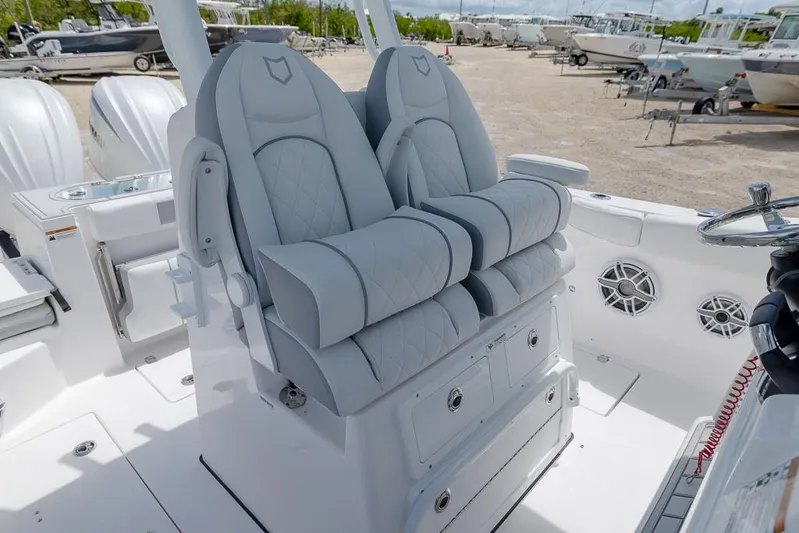  Yacht Photos Pics Luxurious seating on 2026 Sea Fox 288 Commander boat, featuring dual cushioned chairs.
