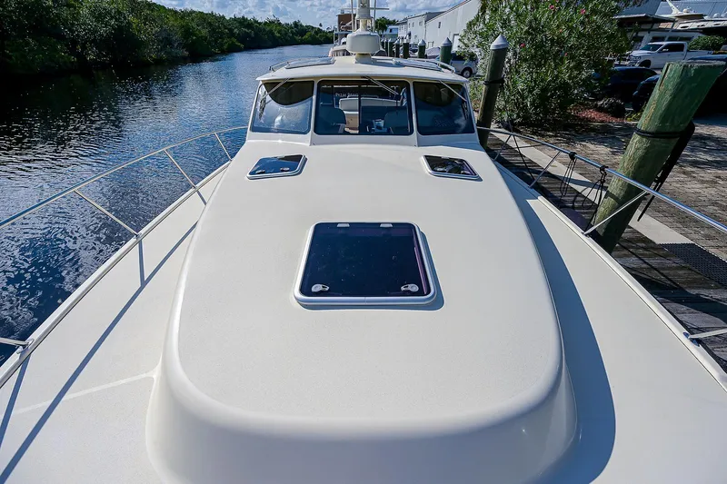 Pb45 2017 Yacht Photos Pics 2017 Palm Beach Motor Yachts PB45 on a serene waterway, showcasing sleek deck design.