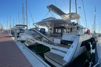 2022 Leopard 42 catamaran docked at marina under clear blue sky.