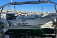 A Highfield inflatable boat with Yamaha motor docked at a marina.