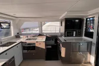 Modern kitchen interior on a 2022 Leopard 42 yacht, featuring sleek appliances and ample counter space.