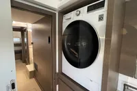Modern laundry area in a 2022 Leopard 42 yacht, featuring a sleek washing machine.