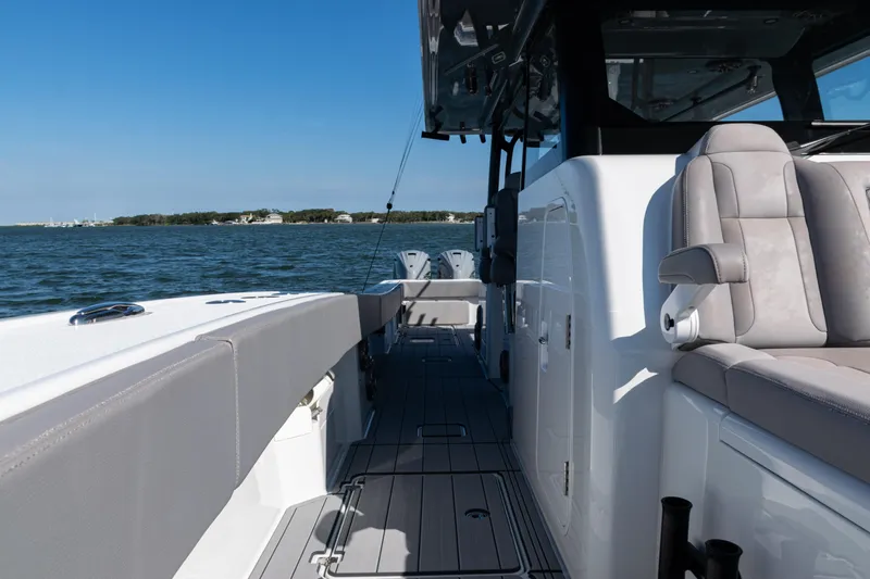  Yacht Photos Pics 2024 Freeman 47 boat interior with seating, on open water under clear blue sky.