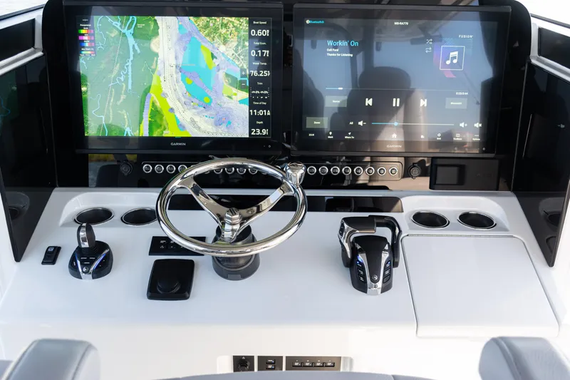  Yacht Photos Pics 2024 Freeman 47 boat dashboard with dual Garmin screens and modern controls.