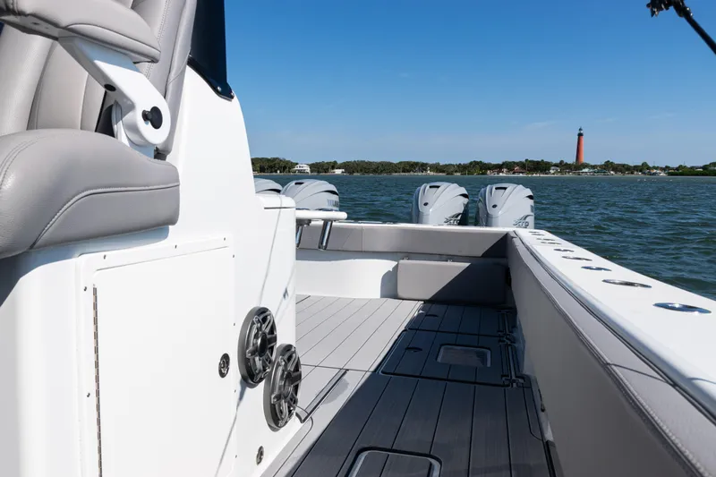  Yacht Photos Pics 2024 Freeman 47 boat interior with ocean view and distant lighthouse.