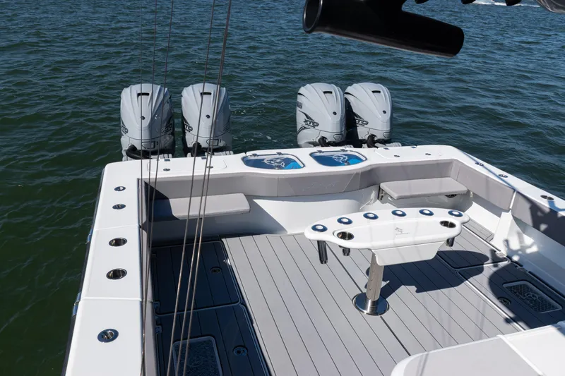  Yacht Photos Pics 2024 Freeman 47 boat deck with four powerful outboard motors on the water.