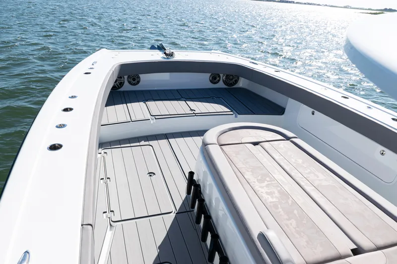  Yacht Photos Pics 2024 Freeman 47 boat deck with seating, on calm water.