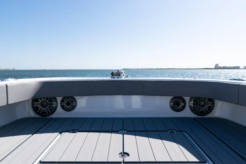  Yacht Photos Pics 2024 Freeman 47 boat deck with ocean view, featuring sleek design and modern speakers.