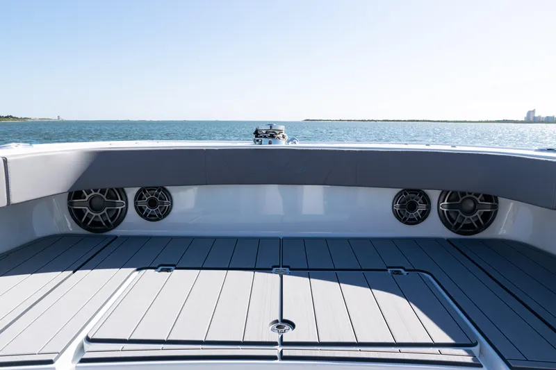  Yacht Photos Pics 2024 Freeman 47 boat deck with speakers, overlooking calm ocean waters.