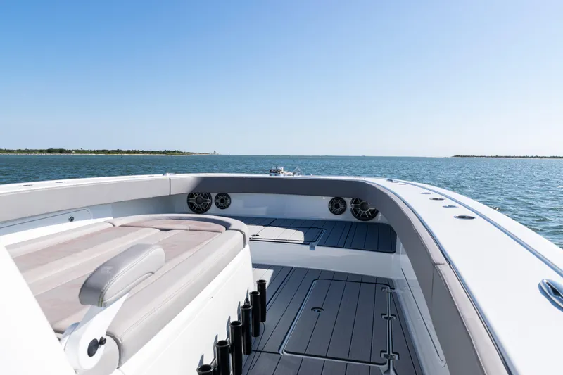  Yacht Photos Pics 2024 Freeman 47 boat interior with ocean view, featuring sleek seating and modern design.