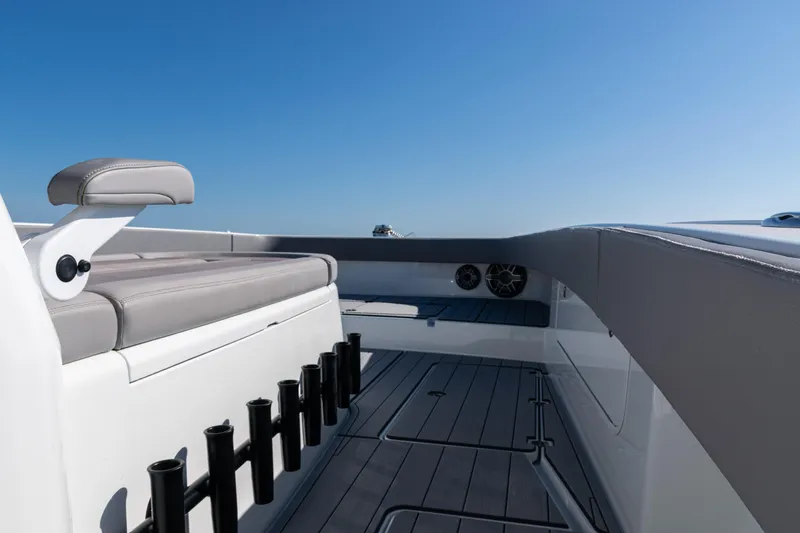  Yacht Photos Pics 2024 Freeman 47 boat interior with seating and rod holders under clear blue sky.