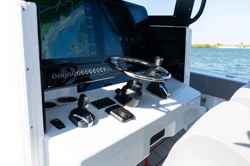  Yacht Photos Pics 2024 Freeman 47 boat helm with advanced navigation system and sleek steering wheel.