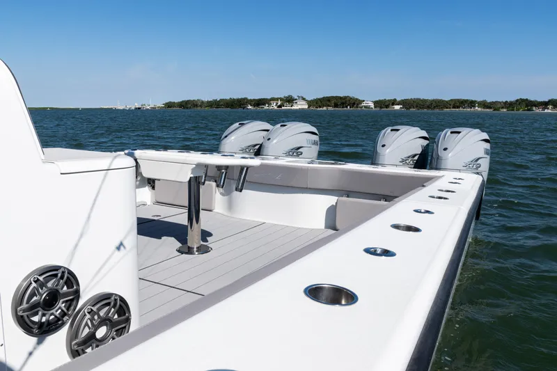  Yacht Photos Pics 2024 Freeman 47 boat with multiple engines on open water.