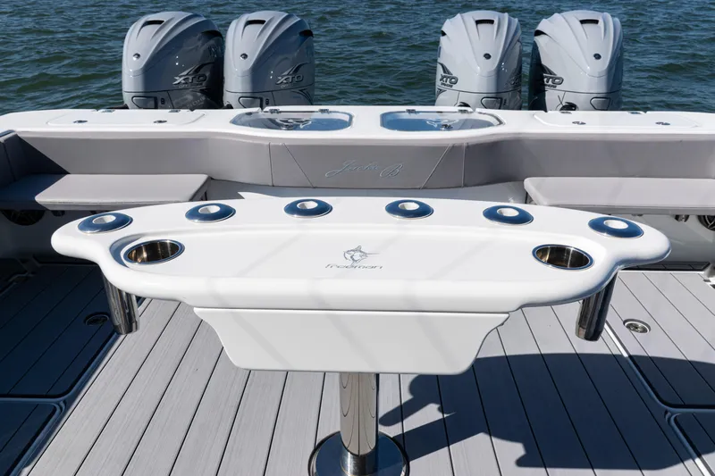  Yacht Photos Pics 2024 Freeman 47 boat with multiple outboard engines and a sleek fishing station.