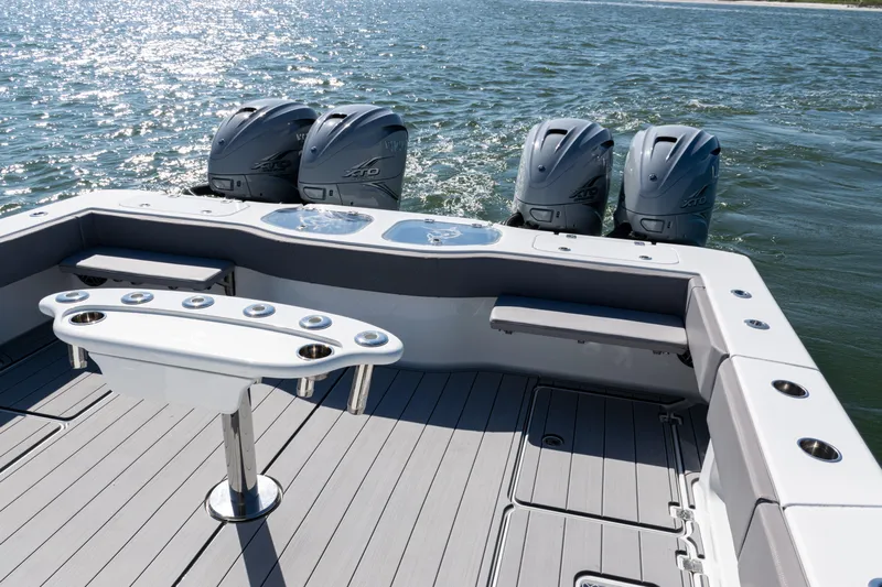  Yacht Photos Pics 2024 Freeman 47 boat with quad outboard engines on open water.