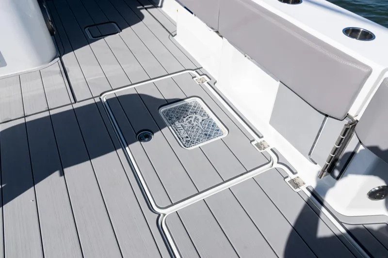  Yacht Photos Pics Freeman 47 boat deck, 2024 model, featuring sleek gray flooring and modern design elements.