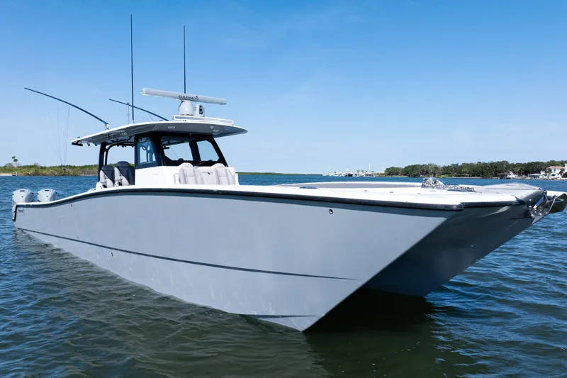  Yacht Photos Pics 2024 Freeman 47 boat on water, sleek design, clear blue sky background.