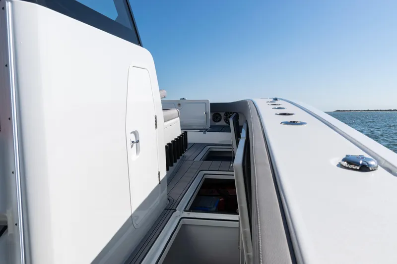  Yacht Photos Pics 2024 Freeman 47 boat deck with storage compartments, sleek design, and ocean view.