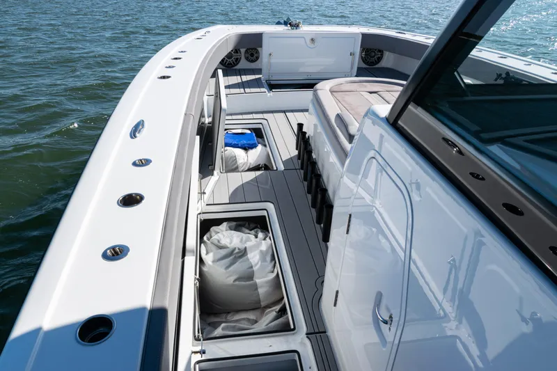  Yacht Photos Pics 2024 Freeman 47 boat interior with storage compartments and seating on open water.