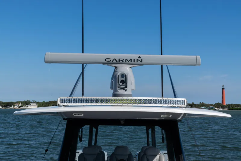  Yacht Photos Pics 2024 Freeman 47 boat with Garmin radar, lighthouse in background.