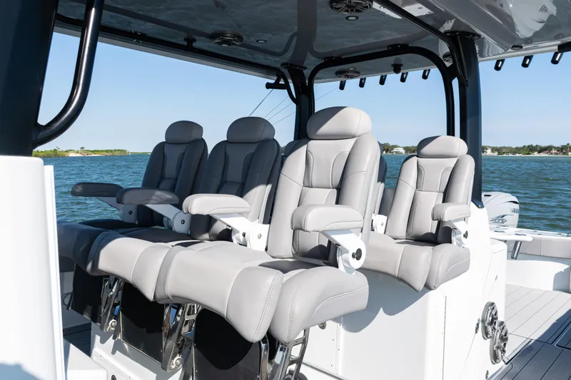  Yacht Photos Pics Luxurious seating on 2024 Freeman 47 boat, featuring sleek design and comfortable armrests.