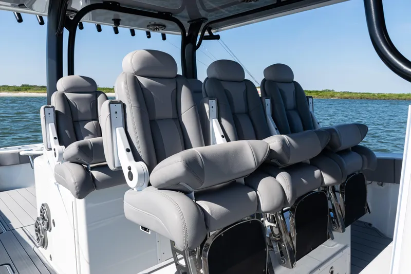  Yacht Photos Pics Luxurious seating on 2024 Freeman 47 boat, featuring plush gray upholstery and ergonomic design.